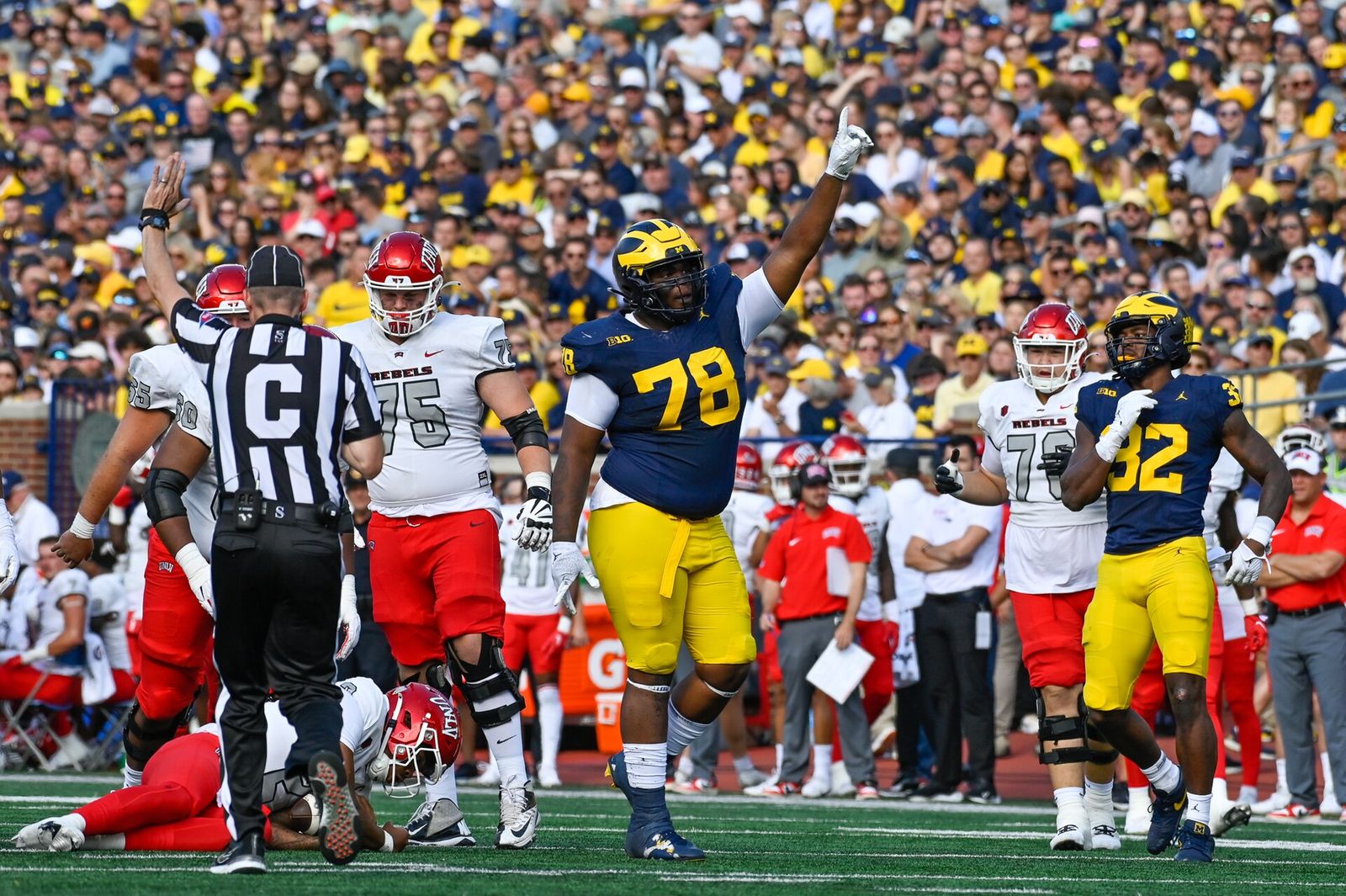 Kenneth Grant celebrates a tackle during a September 2023 football game against the UNLV Rebels at Michigan Stadium.