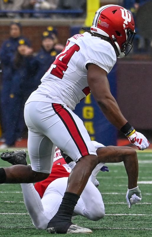 Blake Corum of the Michigan Wolverines carries the ball during an October 2023 game against the Indiana Hoosiers at Michigan Stadium.
