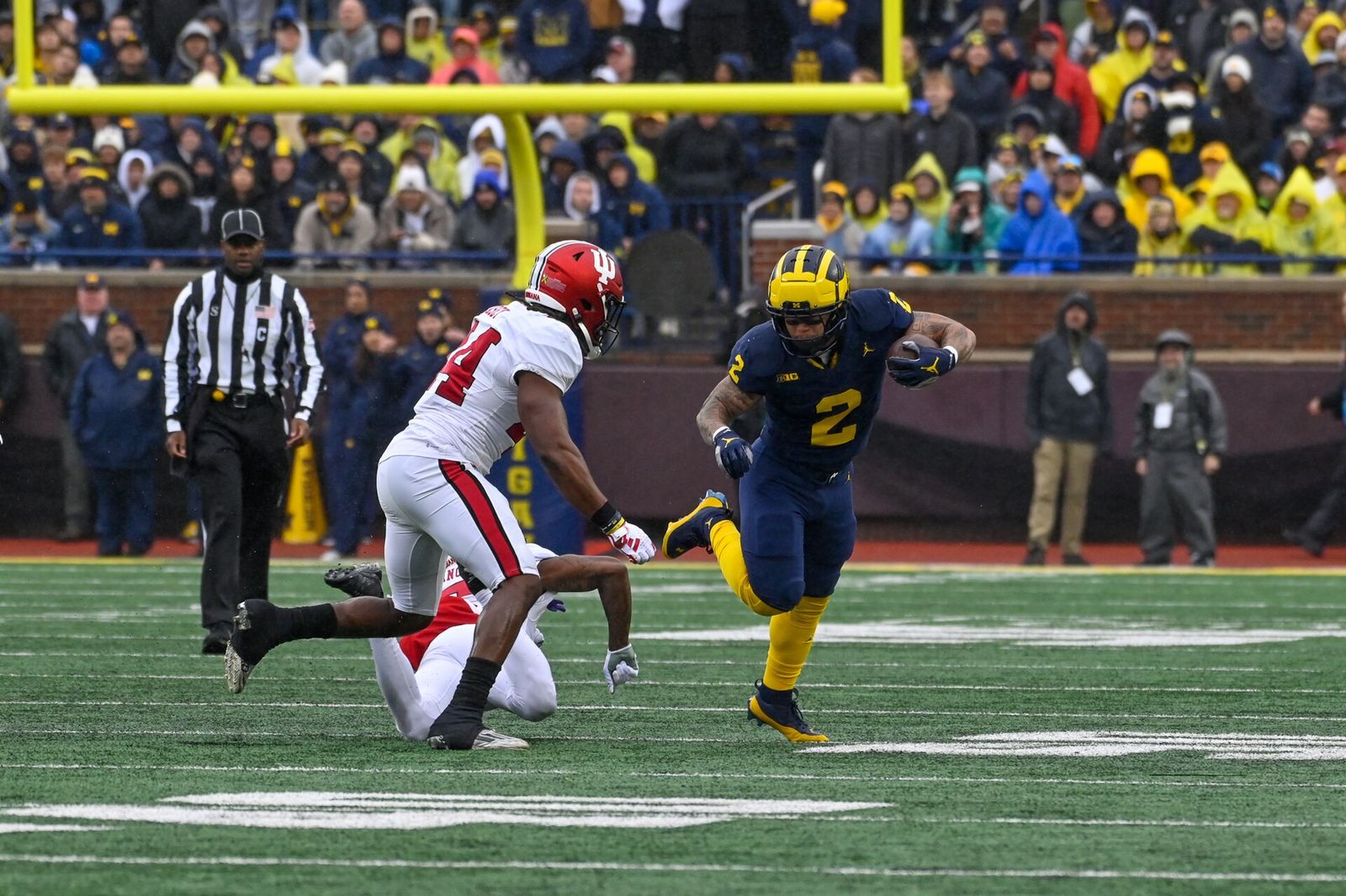 Blake Corum of the Michigan Wolverines carries the ball during an October 2023 game against the Indiana Hoosiers at Michigan Stadium.