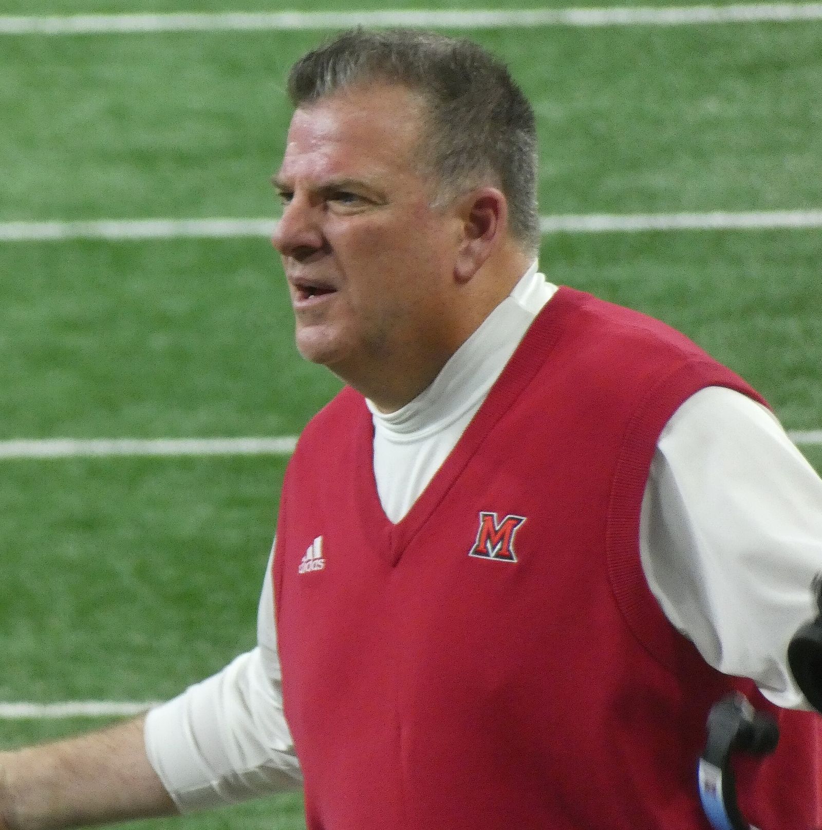 Photo showing Miami RedHawks football head coach Chuck Martin during the 2023 MAC Championship game.
