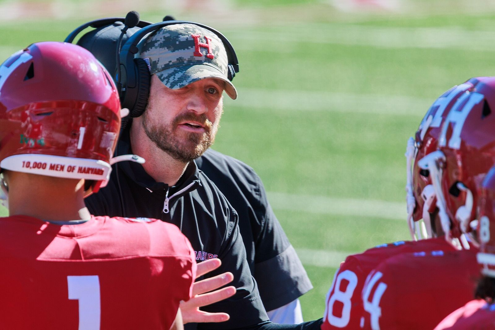 Harvard football head coach Andrew Aurich talks with players. Merrimack Warriors at Harvard Crimson football, October 18, 2025.