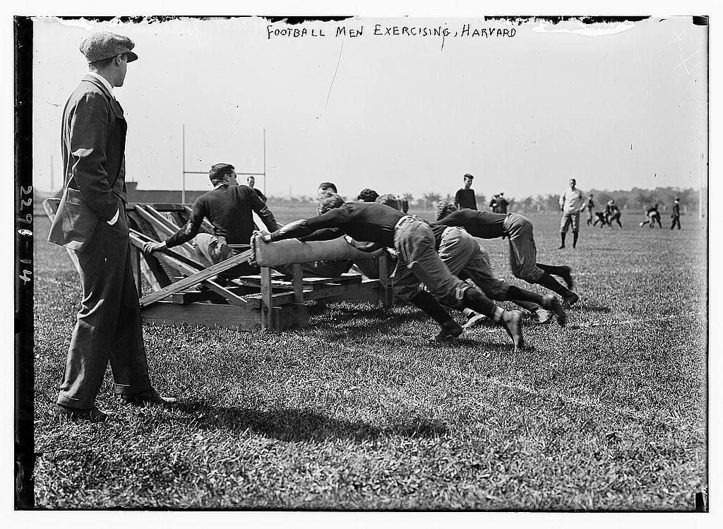 Football men exercising, Harvard.