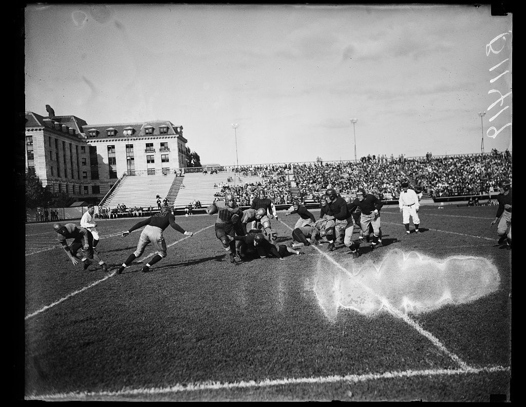 Annapolis, MD. Sept. 25. Bunch, (carrying the ball) starred for the plucky William & Mary eleven as they took a trouncing from Navy here today in the opening of the football season. The final score was 18