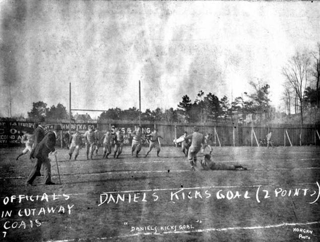 A kicking in the first Iron Bowl at Birmingham.