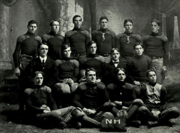 Coach Ward at left end of middle row, team captain Pettee at center
