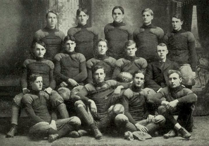 Team captain Hardy is in the middle row, second from right, holding football