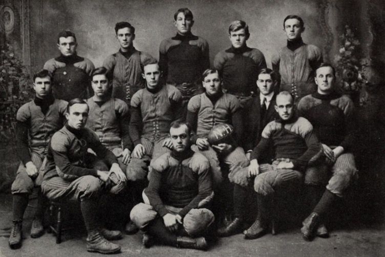Team captain Sanborn is at right-center of the middle row, holding football