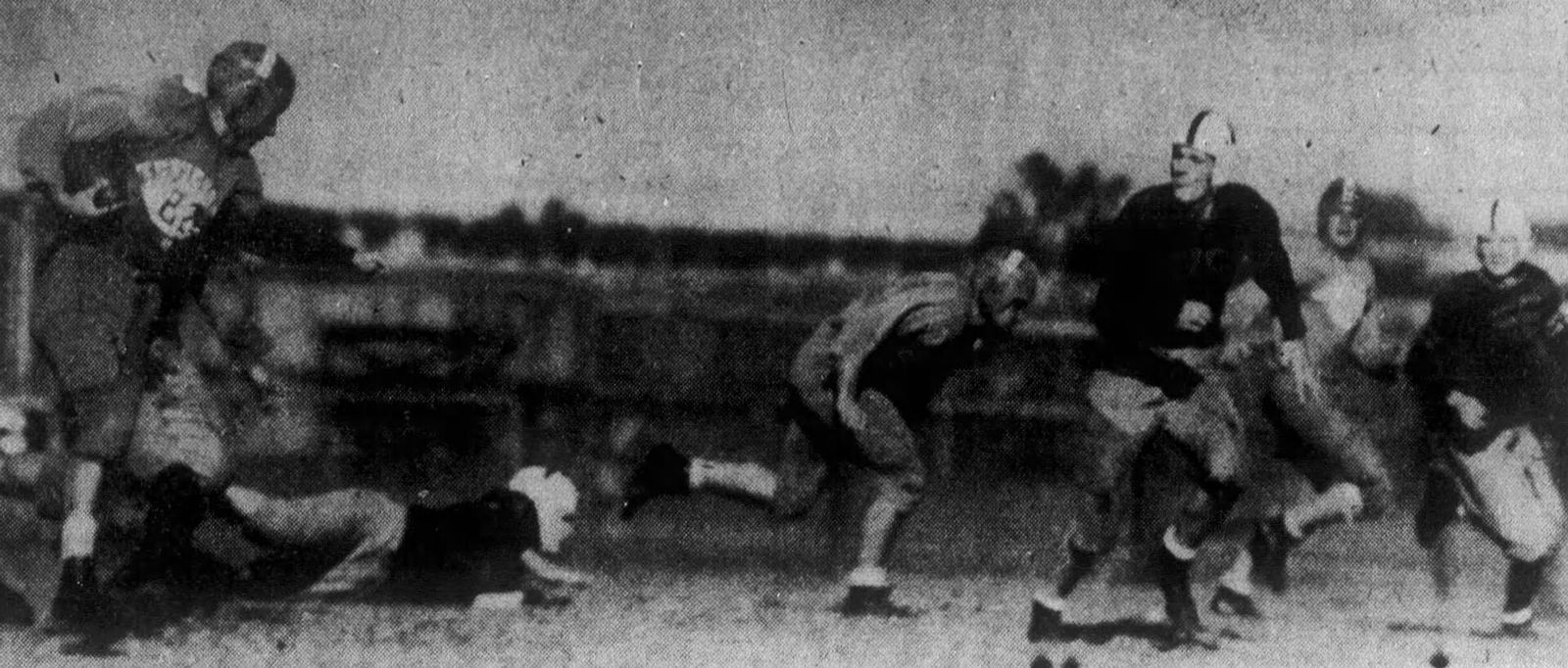 In a photo published by the Knoxville Journal in 1944, the Volunteers' Buster Stephens (left) makes a 30-yard touchdown run in an informal game against Carson–Newman University.