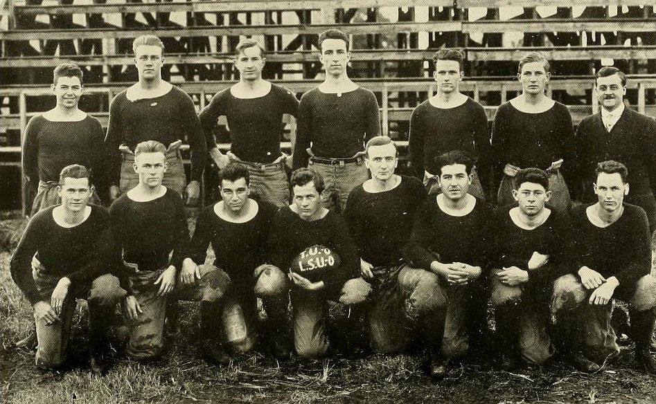 The 1914 team with a football painted to celebrate their tie with LSU